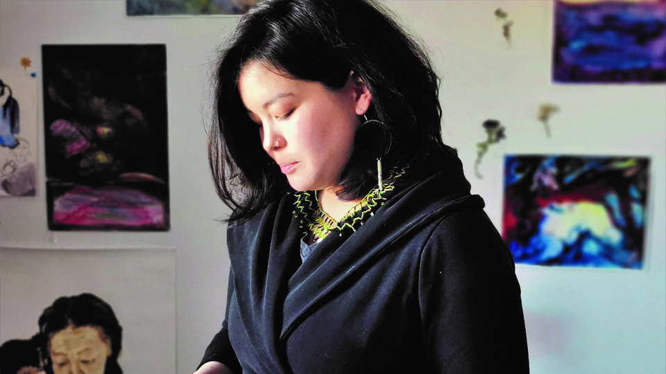 Lady with artwork in background